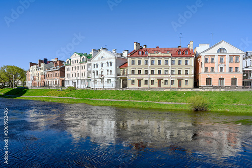 The Golden Embankment quarter on the banks of the Pskova River on a sunny day, Pskov region of Russia