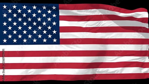 A majestic American flag waving proudly against a dark background, symbolizing freedom and patriotism.