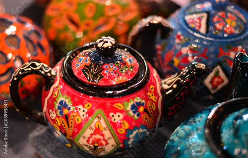 Crowded stalls are dressed in magic with the bright pigments of Asian tradition.