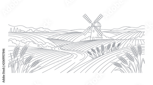 Windmill standing among rolling wheat fields in a rural landscape