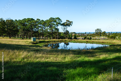 GERRINGONG, NSW, AUSTRALIA – JUNE 23, 2026: Rolling green farmland overlooking the Pacific Ocean along the scenic South Coast near Gerringong, New South Wales, Australia.