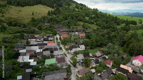 Aerial Drone View of Vlkolínec Village Surrounded by Mountains, Forests and Green Meadows