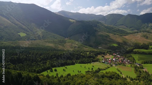 Aerial Drone View of Mala Fatra Mountains with Forests, Meadows and a Small Village in the Distance