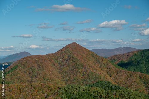 Pyramid shaped mountain covered in autumn foliage