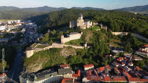 Aerial Drone View of Trenčín Castle and Surrounding Cityscape with Forests and Hills in Slovakia
