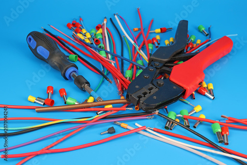 Tools and materials for assembling an electrical switchboard in the workplace.