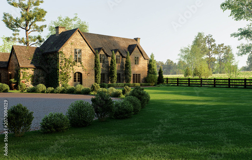 Sunlit stone country house with manicured lawn, trees, and wooden fence in peaceful rural setting