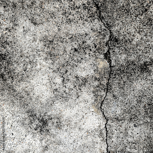 Dark cracked stone wall texture background with vertical fissure