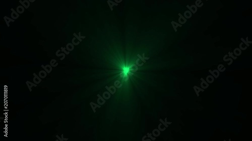 Intense green lens flare effect with radiating light beams on a solid black background for cinematic lighting and visual overlays