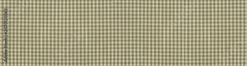 Green and beige checkered gingham fabric texture with a rustic linen weave.