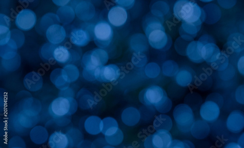 Photos A mesmerizing blurred background featuring various shades of blue bokeh lights, creating a dreamy and soft visual effect perfect for artistic designs