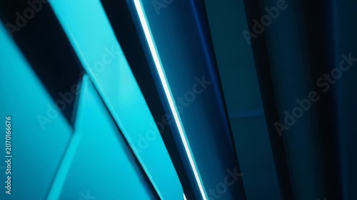 Abstract background presenting a futuristic composition of dark and deep blue geometric structures, reflecting bright neon light tubes and creating a vibrant modern pattern