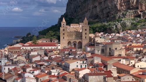 Cefalu, Sicily, aerial drone video. Cefalu beach, cathedral and archeological park, Beautiful Coastal City in Italy.