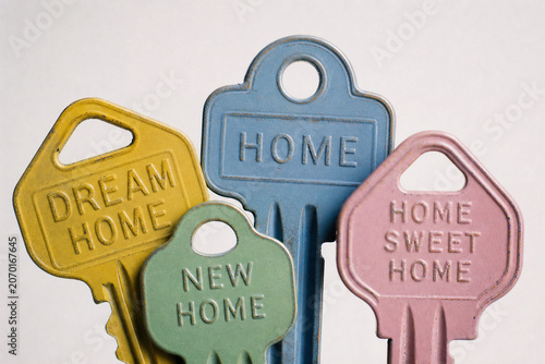 Colorful House Keys Engraved with Dream Home, Home, New Home and Home Sweet Home — Real Estate and First-Time Homebuyer Concept