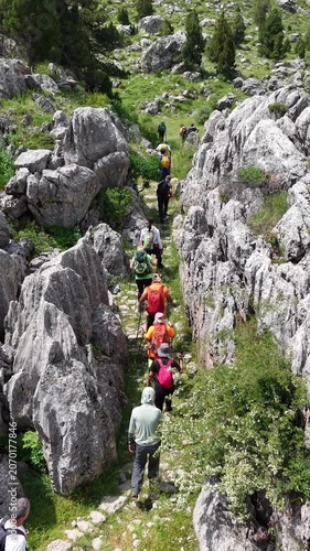 Hikers walking on a historic stone-paved caravan trail