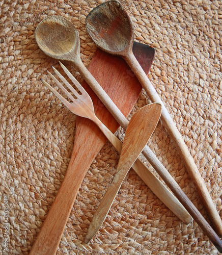 Kitchenware: used wooden spoons and spatulas to stir and fry food  on natural background