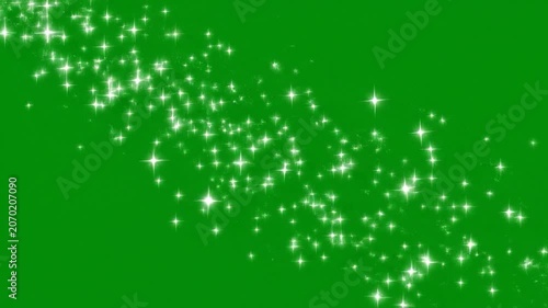 Sparkling white stars falling on a green screen background