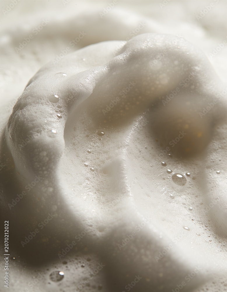 Fototapeta premium Soft white foam bubbles macro texture for skincare and cleansing background