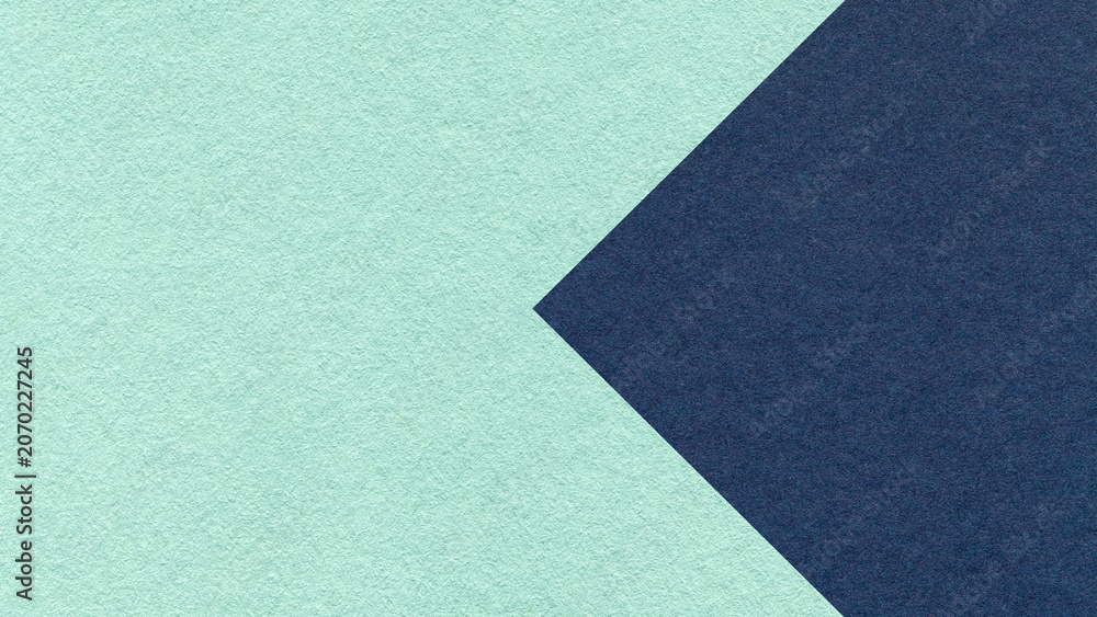 Fototapeta premium Textured light mint green paper background with dark blue arrow, macro. Template with copy space for banner, presentation
