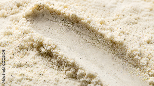 Texture of fine vanilla powder with natural bean seeds