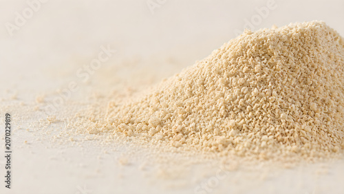 Mound of aromatic vanilla powder on light background