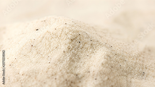 Macro shot of aromatic vanilla sugar powder with bean specks