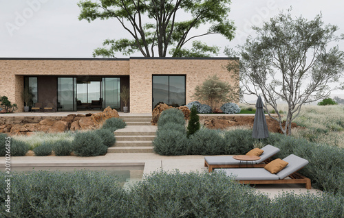 Modern minimalist home with landscaped garden, poolside loungers, and calm outdoor living