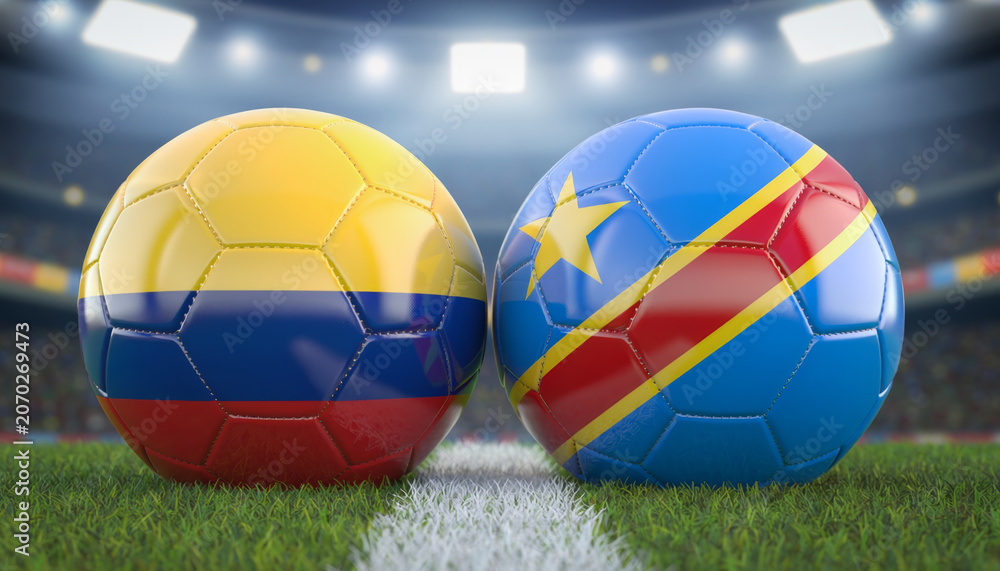 Fototapeta premium Two soccer balls with Colombia and DR Congo flag colors on stadium field under bright lights, creating exciting sports atmosphere