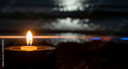 Dim Candle in Dark Room Creates Warm Ambience.