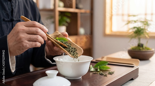 chinese tea leaves gaiwan measured ceremony traditional drink culture hands closeup cultural scene about traditional tea leaves measured into gaiwan lid as precise Chinese tea preparation ritual for