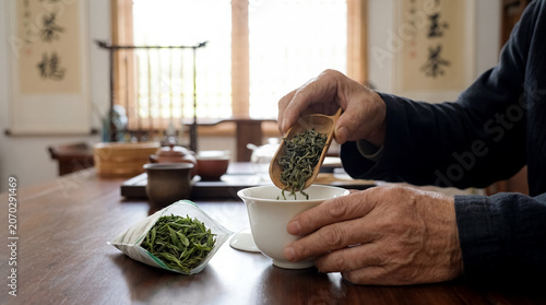 chinese tea leaves gaiwan measured ceremony traditional drink culture hands traditional Chinese heritage concept about traditional tea leaves measured into gaiwan lid as precise Chinese tea