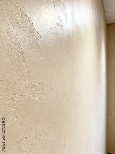 Textured Beige Wall with Soft Lighting