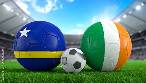 Two soccer balls in flags colors on a stadium blurred background. Curacao vs Ivory Coast 3D image.