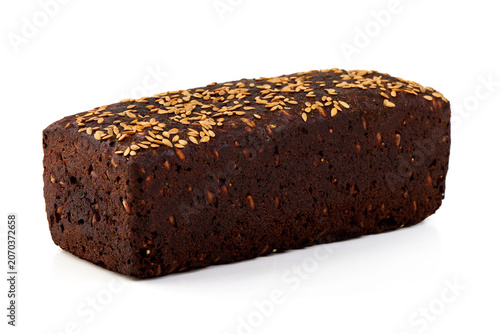 Bild auf Leinwand Loaf of Dark Rye Bread with Flax Seeds