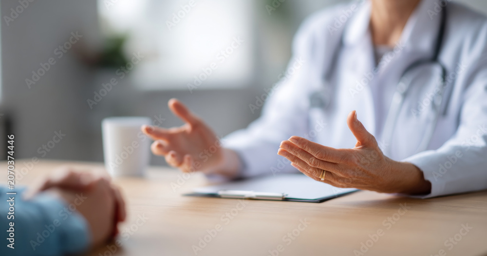 Fototapeta premium Doctor consulting patient in medical