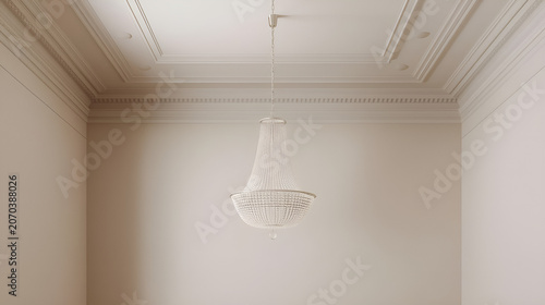 Elegant white chandelier hanging from a decorated ceiling in an empty room.