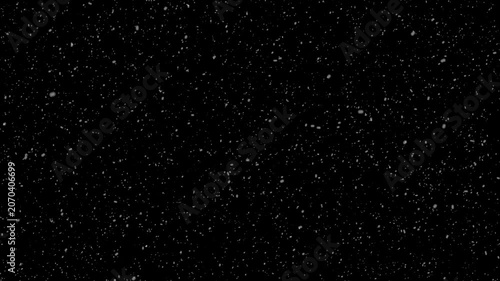 Real snow snowing on black background. snowflakes slowly falling densely against, snow glare and flare sparkles, realistic winter snowfall, high quality winter snowfall animation, 4k video