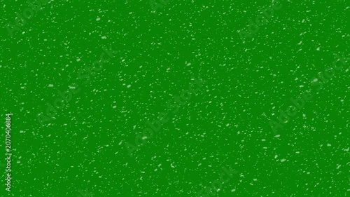 White snow particles floating in the air on green background. snowflakes christmas, rendered animation of snowing, isolated transparent snowfall pattern with overlay effect, 4k video