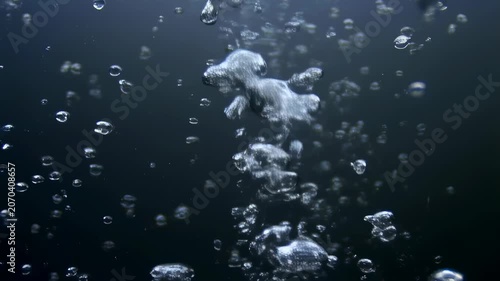 Bubbles rising in clear water, creating a mesmerizing underwater scene. Represents tranquility and the beauty of nature's elements