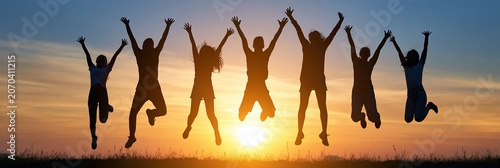 Work Life Joy, Colleagues jump outdoors under warm sunlight, reflecting work-life balance, joy, and a healthy lifestyle.