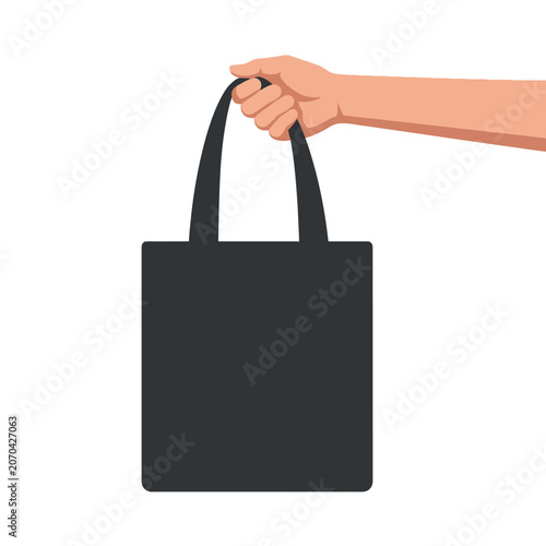 Foto A hand grips a simple black tote bag for everyday errands