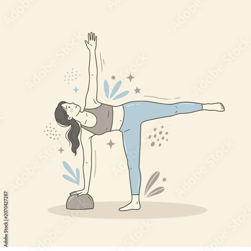 A young woman practices yoga in a half moon pose