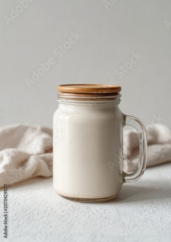 Creamy beverage in jar