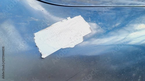 Car Hood With Silver Tape Repair Patch — Automotive Damage Background for Films
