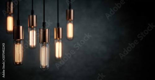 Elegant Vintage Pendant Lights with Warm Glow Against Dark Background