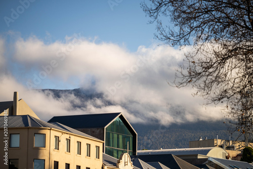 Modern and Heritage Buildings in Hobart with Misty Mount Wellington Background