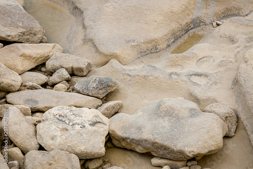 Photos Maltese coastal shore with barren dry terrain and smooth rock formations emphasizing erosion patterns and natural stone textures