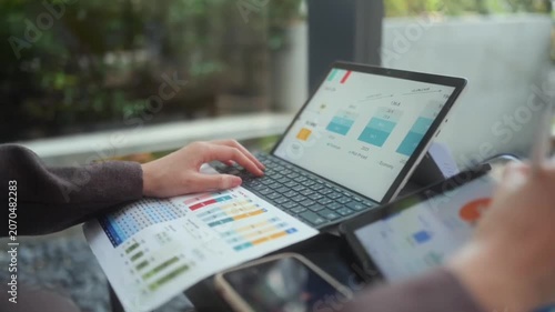 Professional analyzing financial market trends and charts on laptop screen analysis finance data graphs business