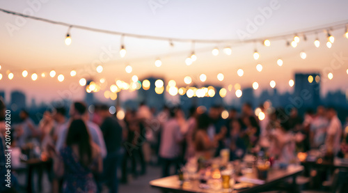 Blurred rooftop party, sunset, bokeh city skyline, background social gathering, celebration, nightlife, evening drinks, people, outdoor event, atmosphere