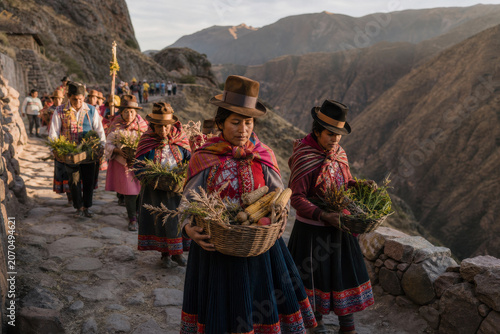 Indigenous women in traditional attire walk along a mountain path while carrying baskets of fresh crops.